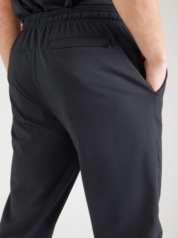 Champion Authentic Athletic Apparel - Tapered Pantalón deportivo en negro