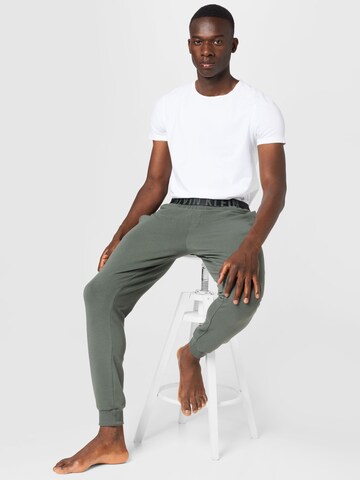 Calvin Klein UnderwearTapered Pidžama hlače - zelena boja