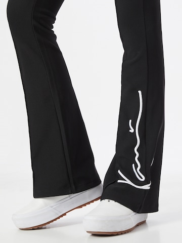 Flared Pantaloni di Karl Kani in nero