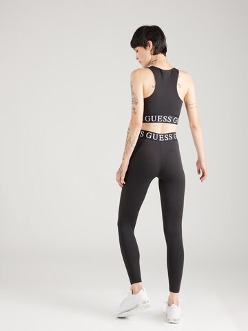 Skinny Pantaloni sportivi 'Kiran' di GUESS in nero