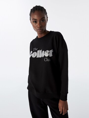 Sweat-shirt Twist en noir : devant