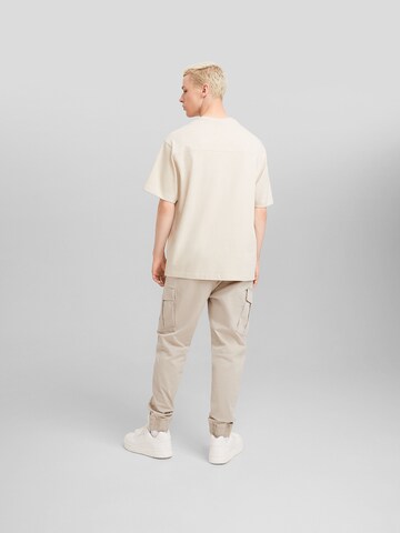 Bershka Tapered Cargo nadrágok - bézs