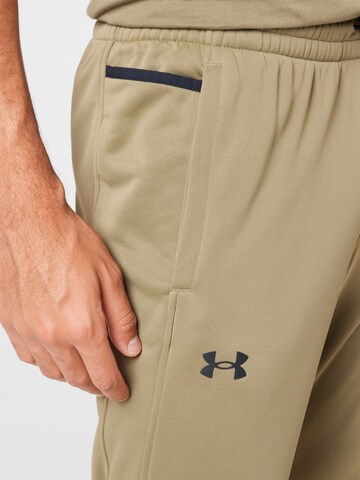 UNDER ARMOUR Tapered Sportbroek in Groen