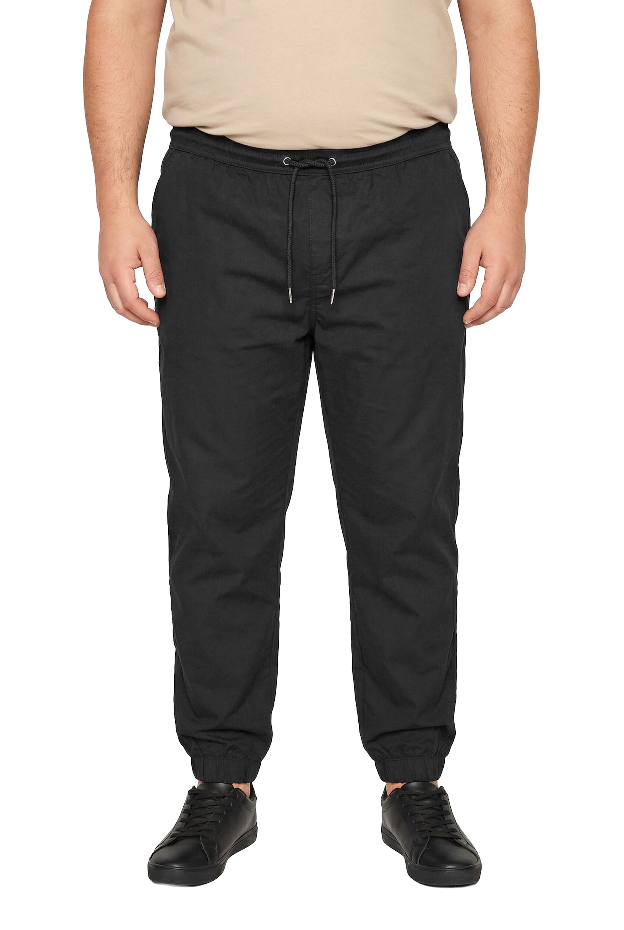Men Plus Tapered Trousers in Black: front