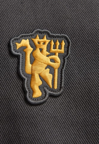 ADIDAS ORIGINALS Loosefit Παντελόνι 'Manchester United Terrace Icons' σε μαύρο