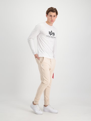 ALPHA INDUSTRIES Tapered Nadrág 'X-Fit' - bézs