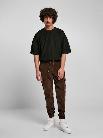 Urban Classics Loose fit Cargo Pants in Green