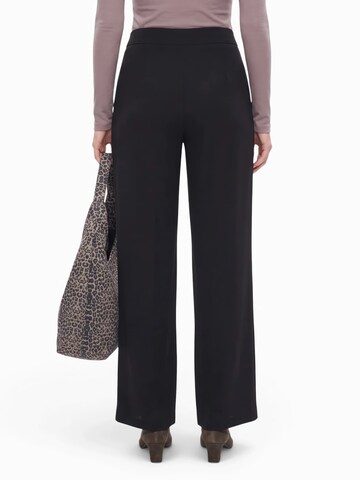 ABOUT YOU Wide leg Trousers 'Zola' in Black: back