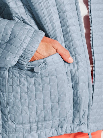 Goldner Jacke in Blau