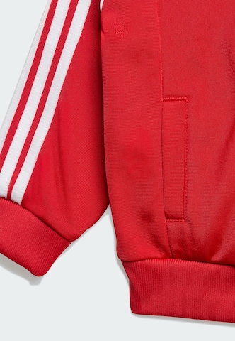 ADIDAS ORIGINALS Joggingpak 'Sst' in Rood