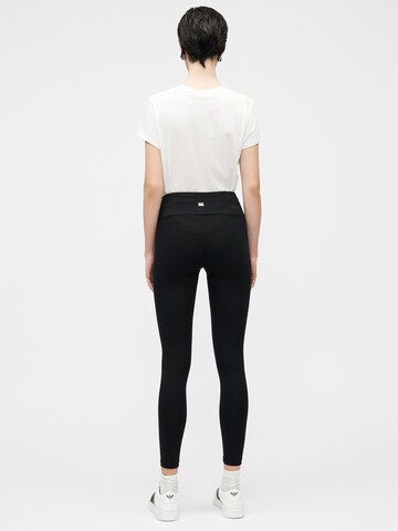 Skinny Pantalon de sport EA7 Emporio Armani en noir