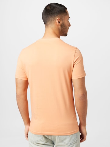 GUESS - Camiseta en naranja
