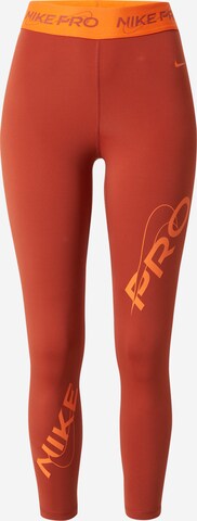 NIKE Skinny Sportbroek in Oranje: voorkant