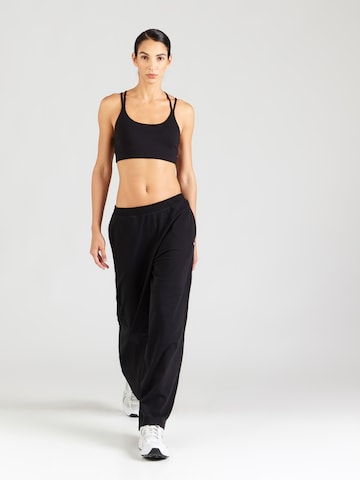 UNDER ARMOUR - Pierna ancha Pantalón deportivo 'Motion' en negro
