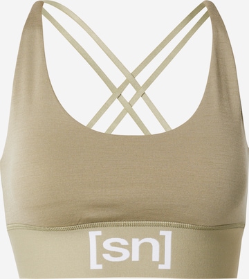 super.natural Sports Bra in Green: front