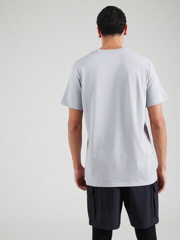 Maglia funzionale di UNDER ARMOUR in grigio