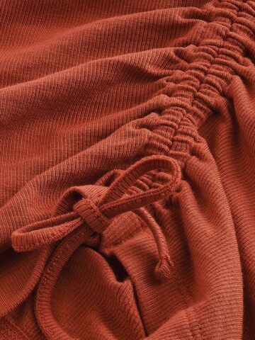 Haut Next en rouge