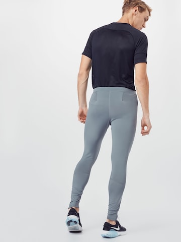 NIKE Skinny Fit Спортен панталон 'Challenger' в сиво