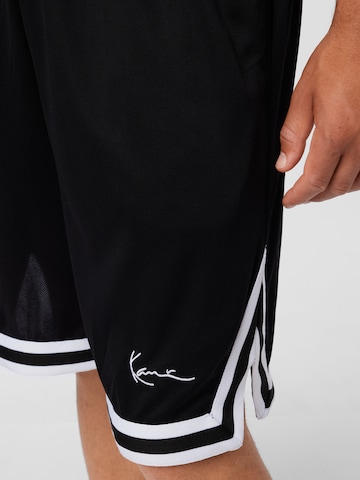 Karl Kani Loose fit Trousers in Black