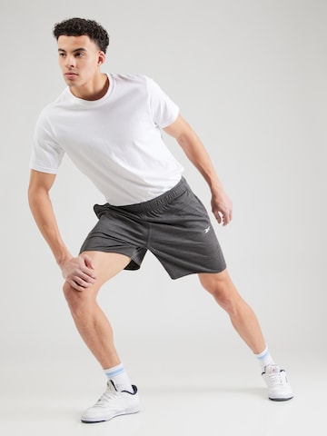 regular Pantaloni sportivi 'ID TRAIN' di Reebok in nero