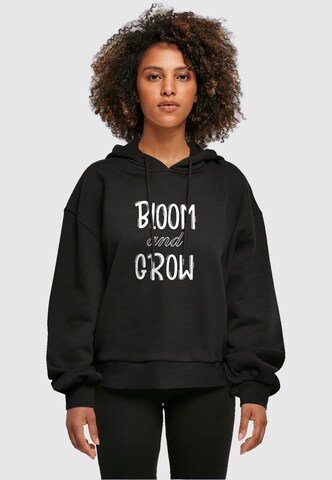 Merchcode Sweatshirt 'Spring - Bloom And Grow' in Black: front