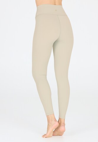 Athlecia Skinny Sports trousers 'FRANZ' in Brown