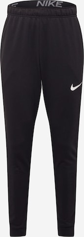 NIKE Tapered Sports trousers in Black: front