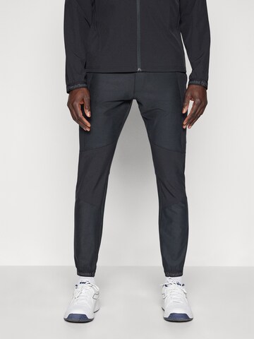 Sergio Tacchini Zwężany krój Spodnie sportowe 'Pelle' w kolorze czarny: przód