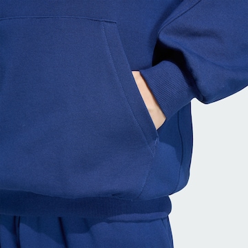 ADIDAS SPORTSWEAR - Camiseta deportiva en azul