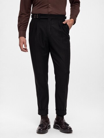 Antioch Tapered Pleat-front trousers in Black