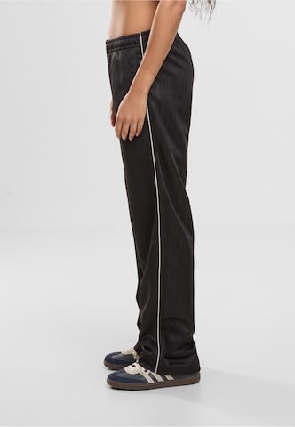 regular Pantaloni di Karl Kani in nero