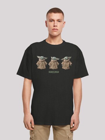 T-Shirt 'Star Wars The Mandalorian The Child Poses' F4NT4STIC en noir : devant