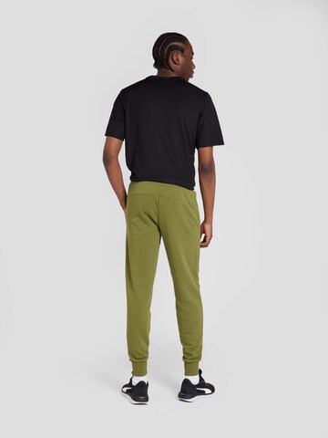 Effilé Pantalon de sport 'ESS+' PUMA en vert