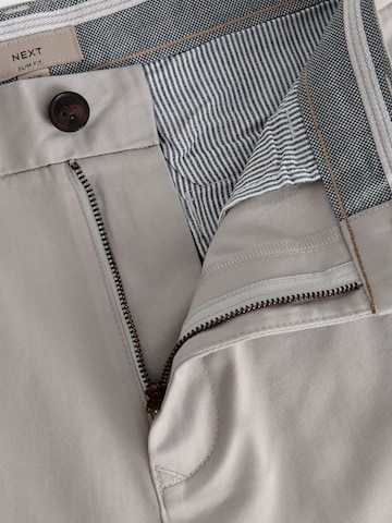 Slimfit Pantaloni chino di Next in grigio