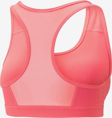 Bustino Reggiseno sportivo di PUMA in arancione