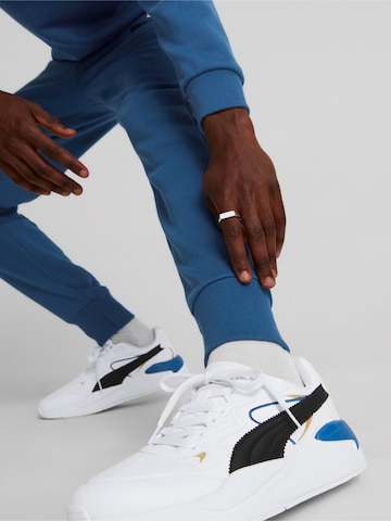 Tapered Pantaloni sport 'ESS+' de la PUMA pe albastru