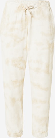 Nike Sportswear Tapered Pants in Beige: front