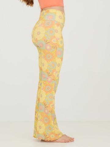 ABOUT YOU x Sofia Tsakiridou Flared Trousers 'LOU' in Yellow