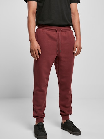 Urban Classics Trousers in Red: front