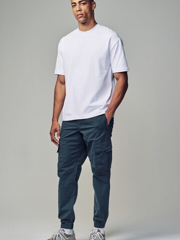 Next Конический (Tapered) Брюки-карго в Синий