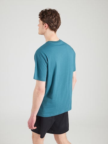 PUMA Koszulka funkcyjna 'ESS No. 1' w kolorze zielony