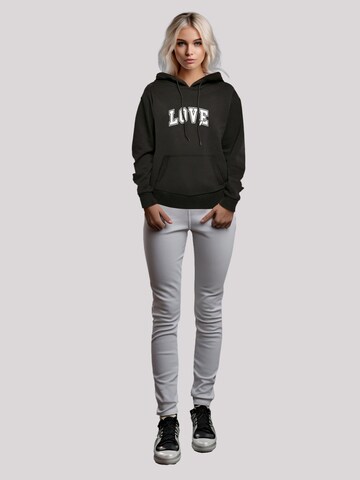 Sweat-shirt 'Love University Valentinstag Herz' F4NT4STIC en noir