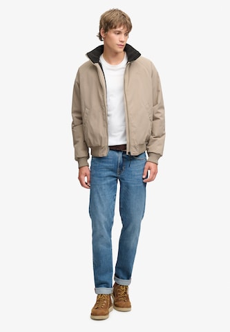 Superdry & Co Tussenjas 'City' in Bruin