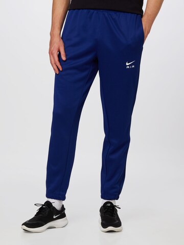 Nike Sportswear Tapered Trousers in Blue: front