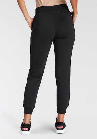 PUMA - Tapered Pantalón deportivo en negro