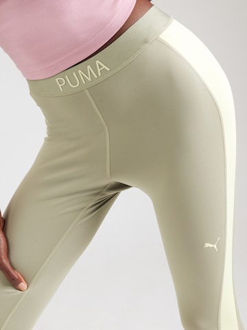 PUMA Skinny Sportbroek 'STRONG' in Groen