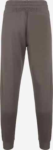 UNDER ARMOUR Tapered Workout Pants in Brown