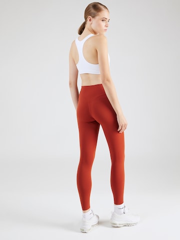 Skinny Pantalon de sport 'ZENVY' NIKE en orange
