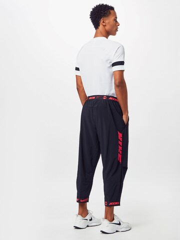 NIKE Tapered Sportbroek in Zwart