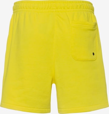 Nike Sportswear Regular Pants 'Club' in Yellow